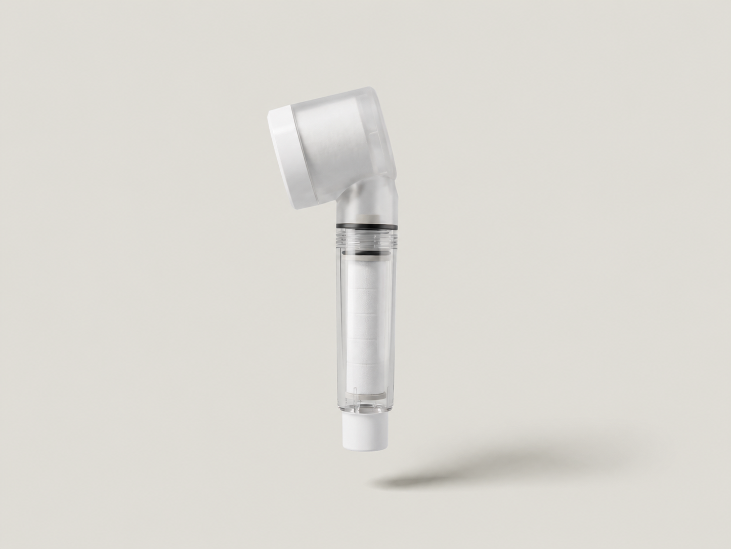 Aurajex Triple Defense travel shower filter head with clear cartridge chamber showing filter cotton