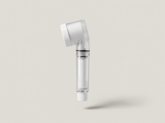 Aurajex Triple Defense travel shower filter head with clear cartridge chamber showing filter cotton